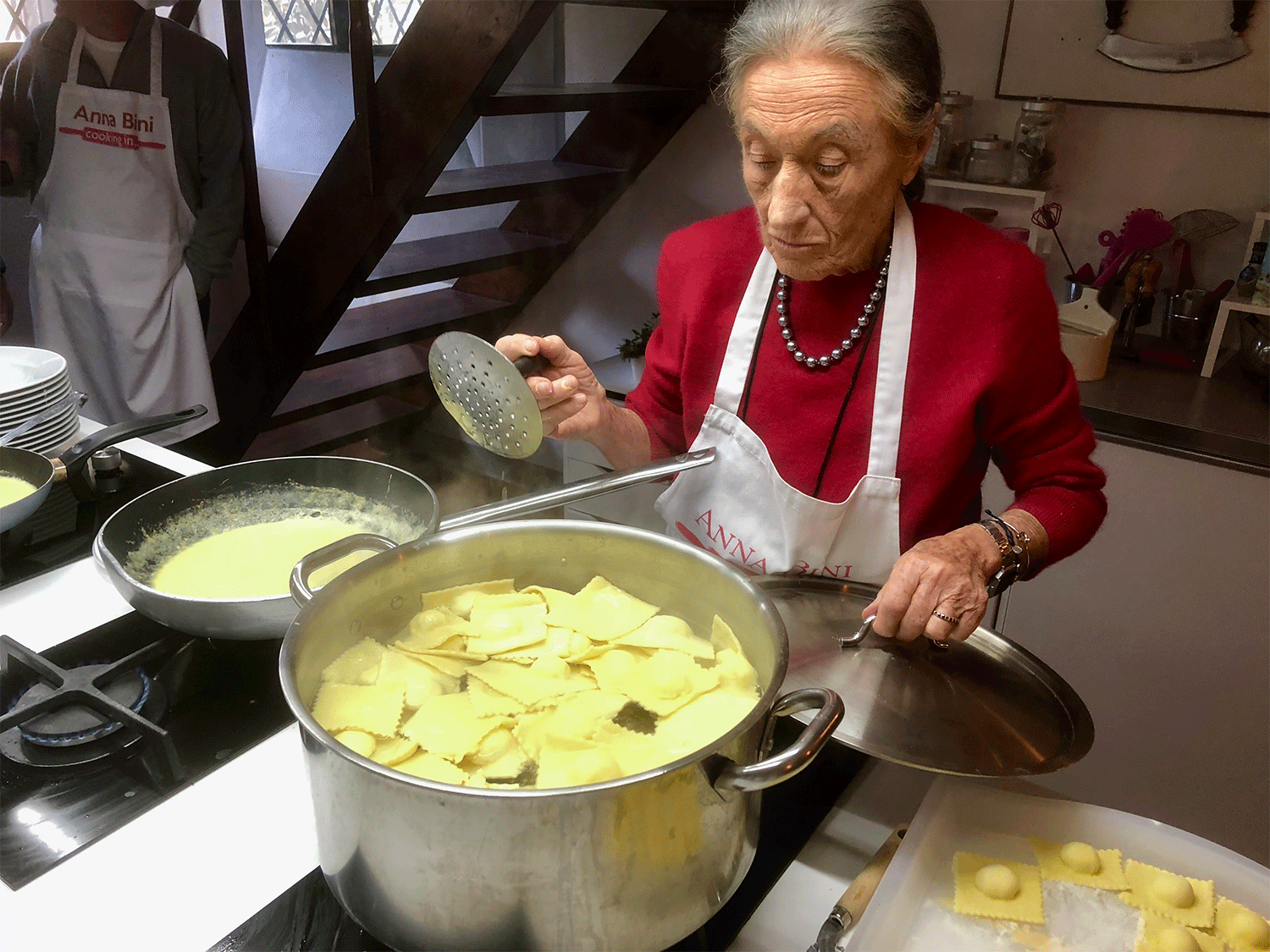Anna Bini with pot of ravioli