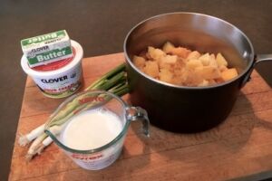 butter, sour cream, scallions and cooked celery root, rutabagas & Yukon Gold potatoes